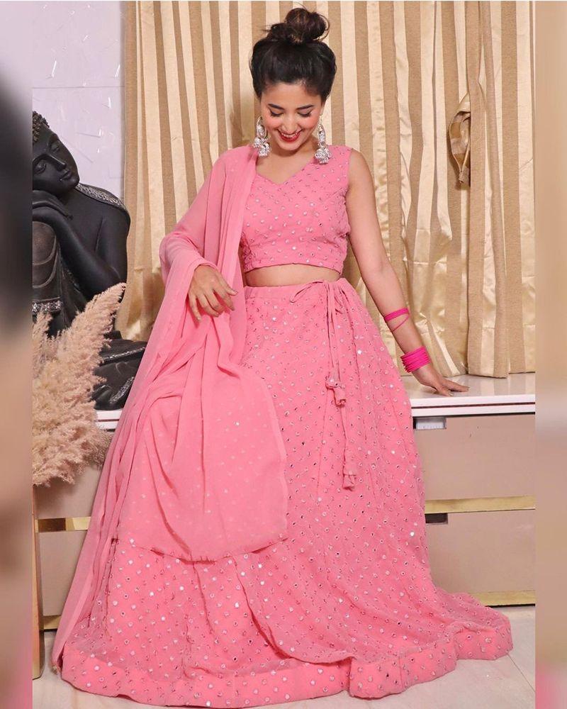 Lehenga choli with floral motifs, Lehenga choli with thread work, Lehenga choli with hand-painted designs, Lehenga choli with brocade fabric, Lehenga choli with velvet fabric, Lehenga choli with net fabric, Indian traditional wear, Ethnic attire, Indian bridal outfit, Lehenga with heavy embroidery
